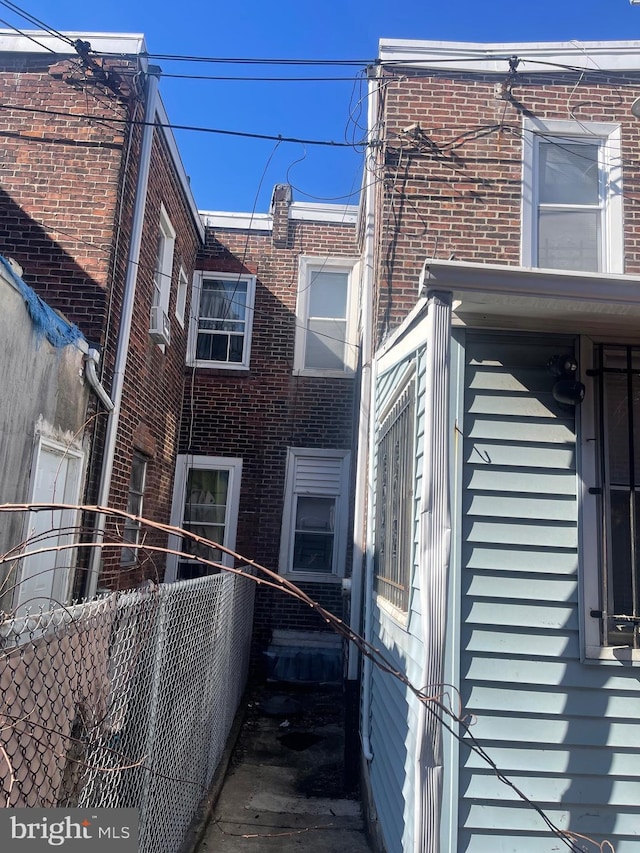 view of property exterior with brick siding