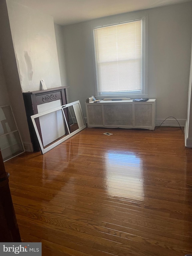 interior space featuring wood finished floors and visible vents