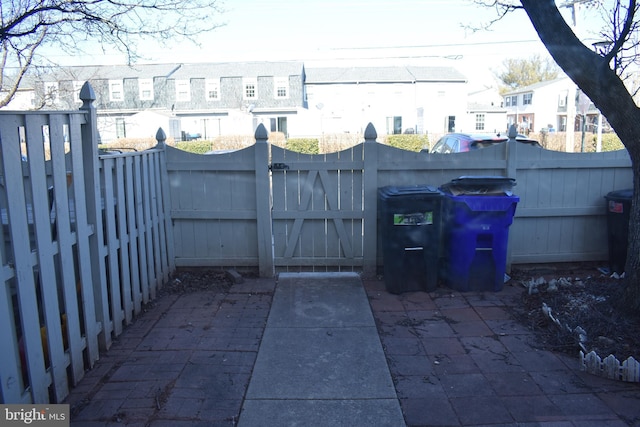 view of patio with a residential view and fence