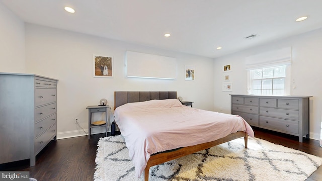 bedroom featuring visible vents, dark wood-type flooring, and recessed lighting