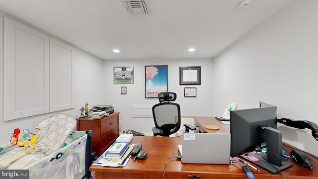 office area with visible vents and recessed lighting