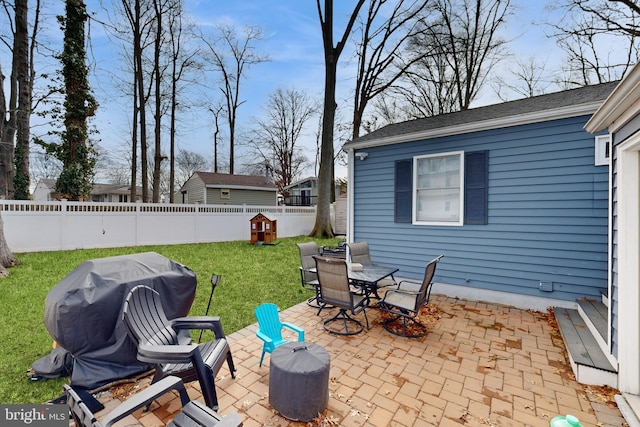 view of patio / terrace featuring outdoor dining area, area for grilling, and a fenced backyard