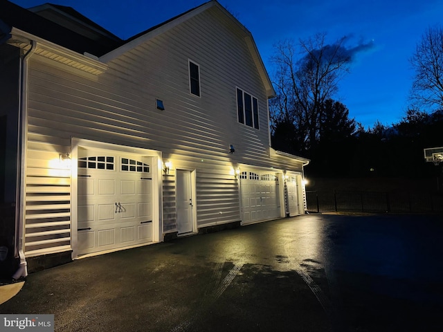 view of property exterior featuring an attached garage