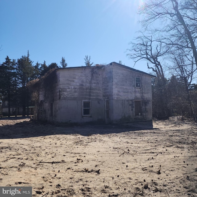 view of side of property with an outbuilding