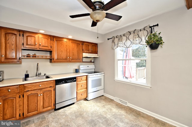 kitchen featuring under cabinet range hood, white electric range, a sink, visible vents, and stainless steel dishwasher