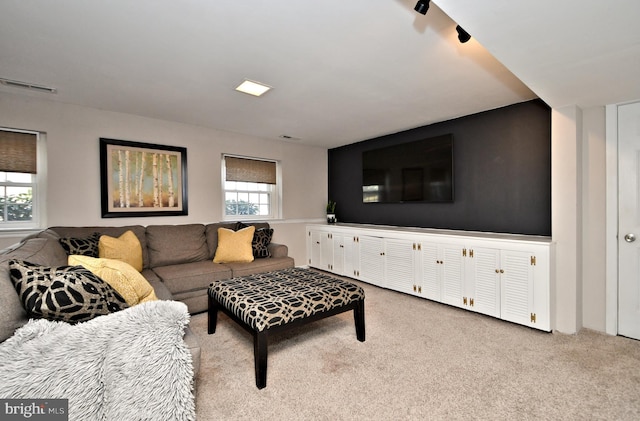 carpeted living room featuring visible vents