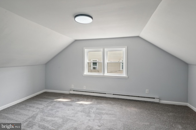 bonus room with lofted ceiling, carpet, a baseboard heating unit, and baseboards