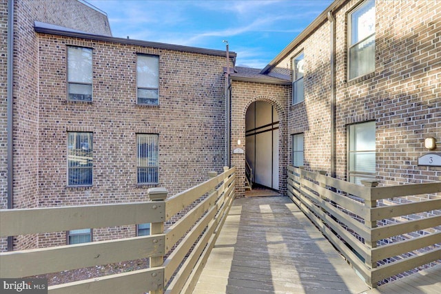 exterior space featuring brick siding