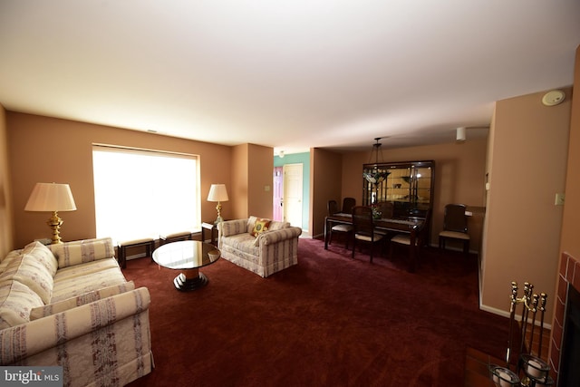 living room featuring carpet and baseboards