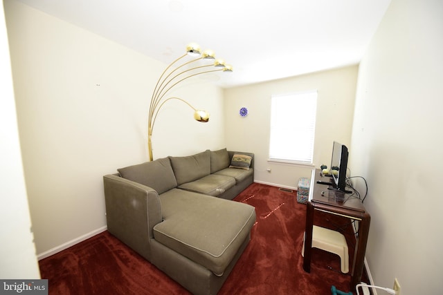 living room featuring baseboards and visible vents