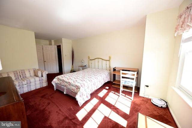 carpeted bedroom with baseboards