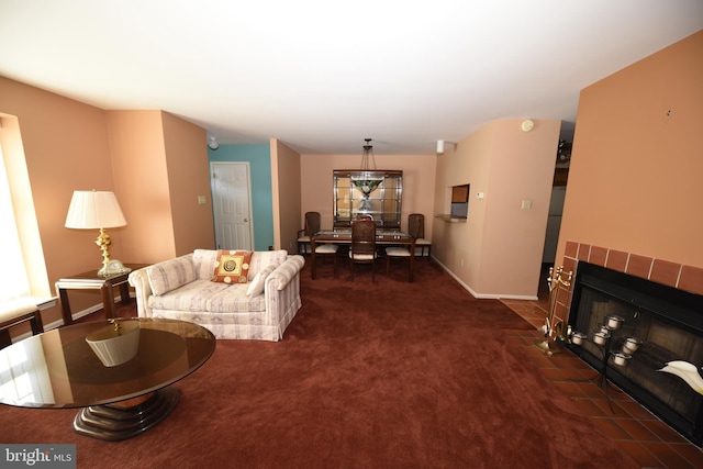 living room featuring carpet flooring, a fireplace, and baseboards