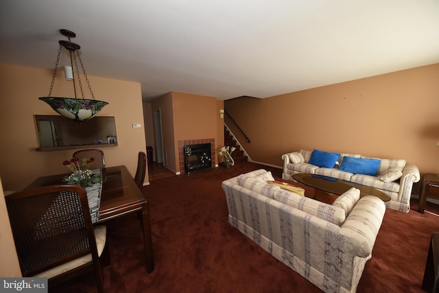 living room featuring stairs and carpet flooring