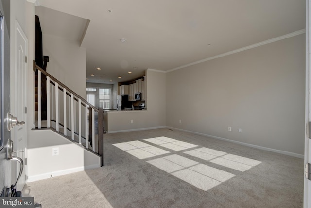 unfurnished living room featuring carpet floors, ornamental molding, stairway, and baseboards