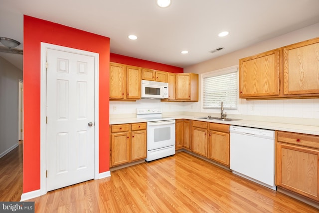 2115 Ruxton Dr, Salisbury, MD 21801 - kitchen with white appliances, a sink, light countertops, light wood-style flooring, and recessed lighting