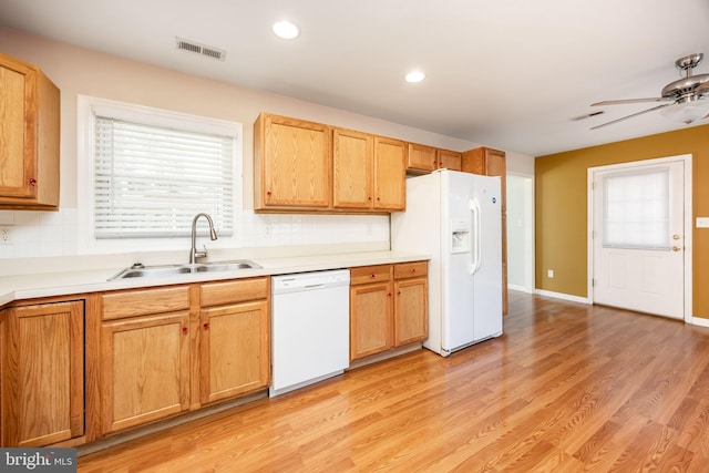2115 Ruxton Dr, Salisbury, MD 21801 - kitchen with white appliances, a sink, a ceiling fan, decorative backsplash, and plenty of natural light
