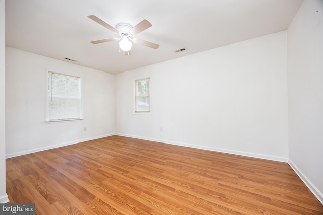2115 Ruxton Dr, Salisbury, MD 21801 - empty room with healthy amount of natural light, light wood finished floors, and baseboards