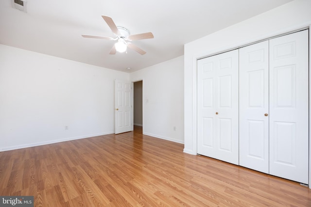 2115 Ruxton Dr, Salisbury, MD 21801 - unfurnished bedroom featuring light wood-style flooring, baseboards, a closet, and a ceiling fan