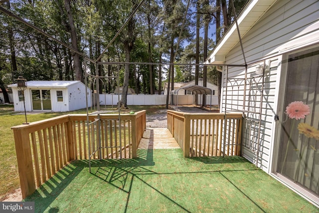 2115 Ruxton Dr, Salisbury, MD 21801 - wooden terrace featuring an outdoor structure and view of scattered trees