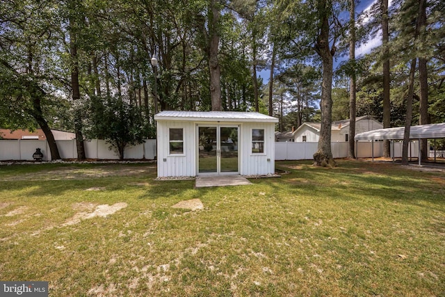 2115 Ruxton Dr, Salisbury, MD 21801 - view of yard featuring a carport and an outdoor structure