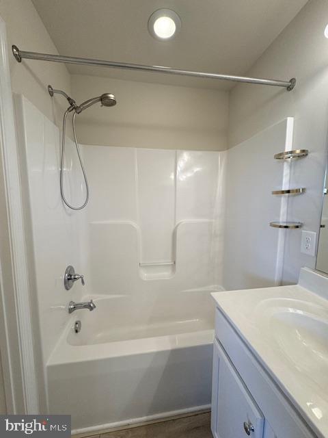 bathroom with tub / shower combination and vanity