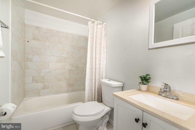 bathroom featuring toilet, shower / tub combo with curtain, and vanity