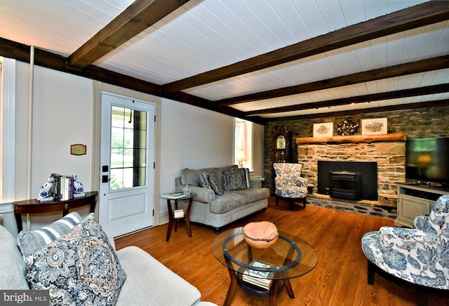 1200 Branch Rd, Perkasie, PA 18944 - living room featuring a wood ceiling with exposed beams, wood finished floors, and a fireplace
