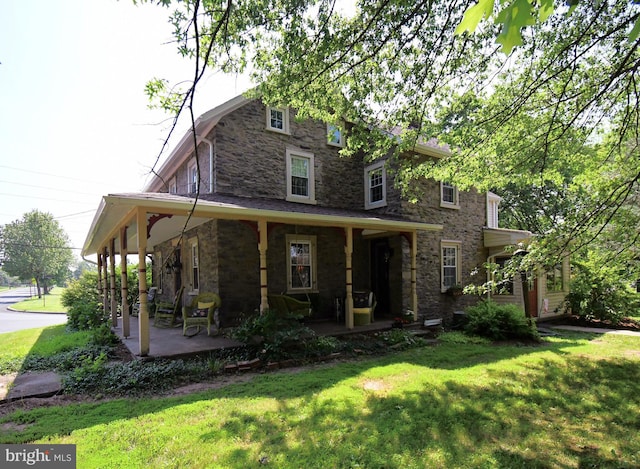1200 Branch Rd, Perkasie, PA 18944 - view of front of house with stone siding, a front lawn, and covered porch