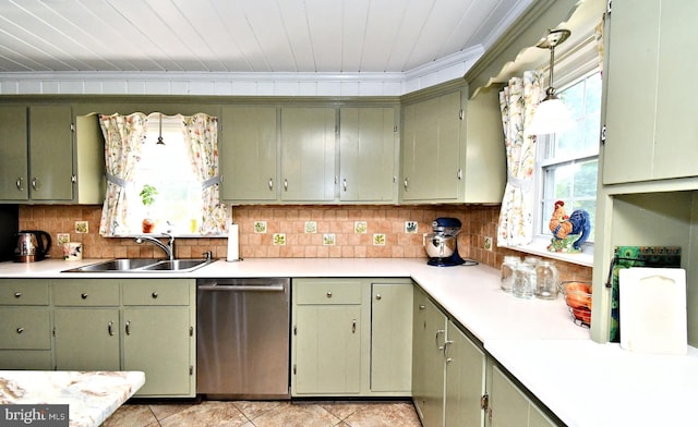 1200 Branch Rd, Perkasie, PA 18944 - kitchen with stainless steel dishwasher, light countertops, crown molding, backsplash, and light tile patterned flooring