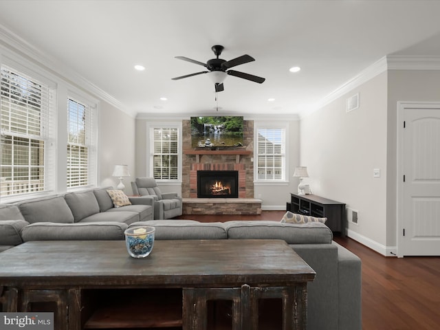 living room with visible vents, dark wood-style flooring, and ornamental molding