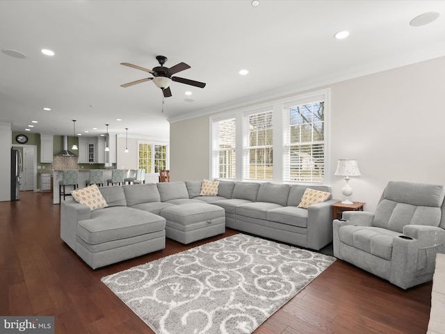 living room featuring recessed lighting, a ceiling fan, dark wood-style floors, and crown molding