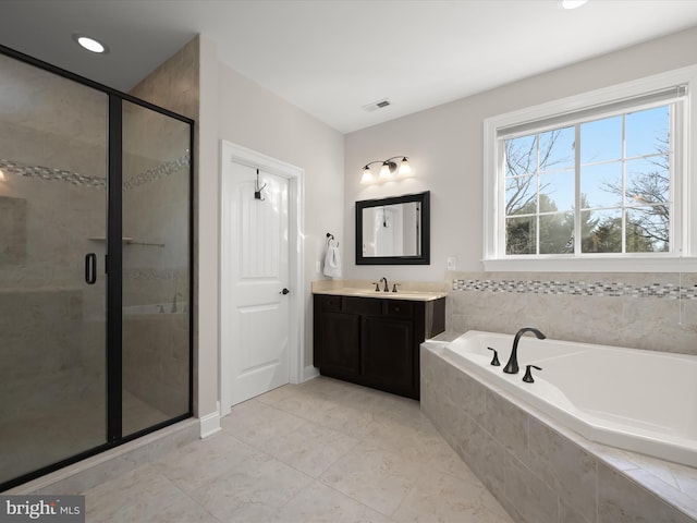 bathroom with visible vents, a garden tub, a stall shower, recessed lighting, and vanity