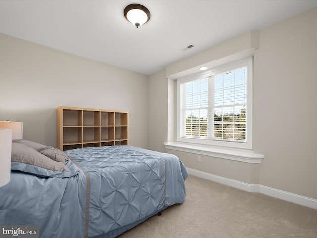 bedroom featuring carpet flooring, baseboards, and visible vents