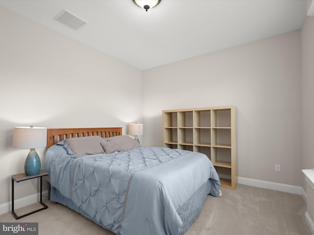 bedroom with carpet flooring, baseboards, and visible vents