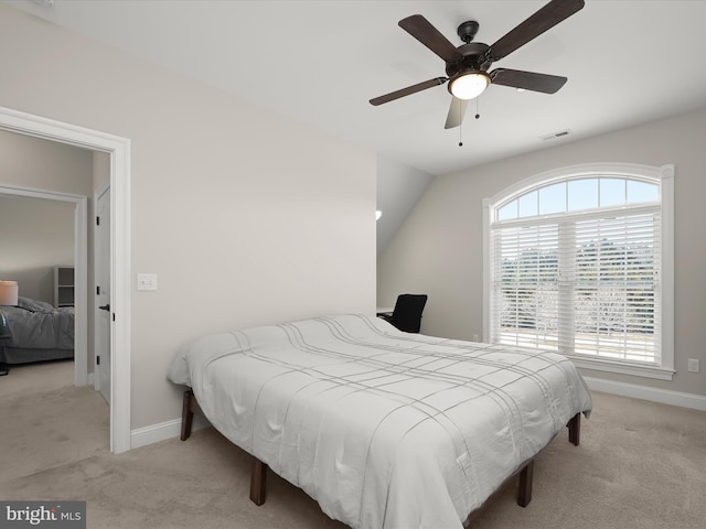 carpeted bedroom with visible vents, baseboards, and ceiling fan