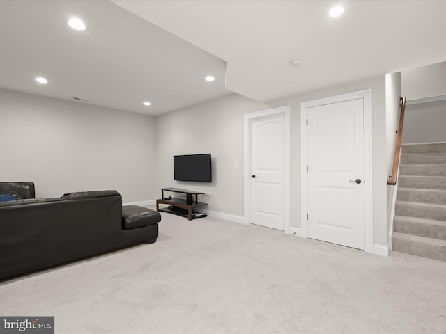 living area with recessed lighting, baseboards, carpet floors, and stairs