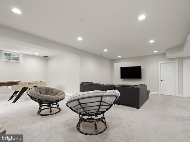 living room featuring recessed lighting, baseboards, and carpet floors