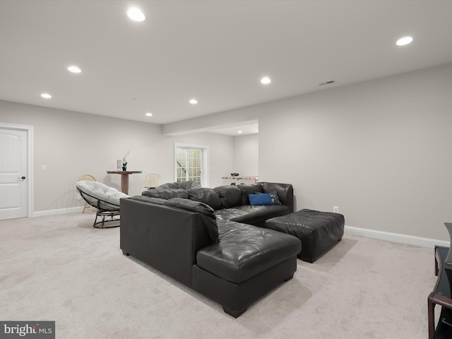 living room with recessed lighting, visible vents, light carpet, and baseboards