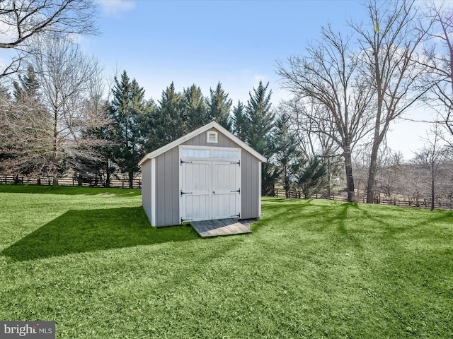 view of shed featuring fence