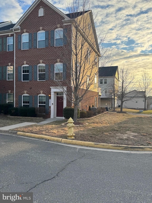 view of front of house featuring brick siding