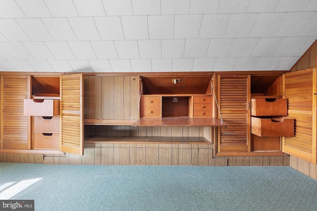 interior space with vaulted ceiling and carpet