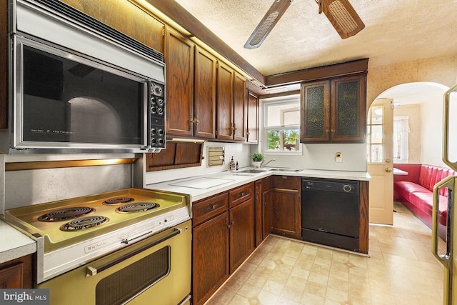 kitchen with ceiling fan, black dishwasher, light countertops, electric range oven, and stainless steel microwave