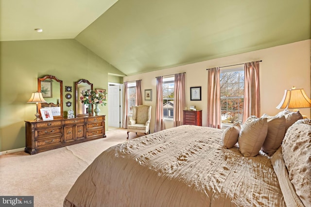 bedroom featuring lofted ceiling, carpet flooring, and baseboards