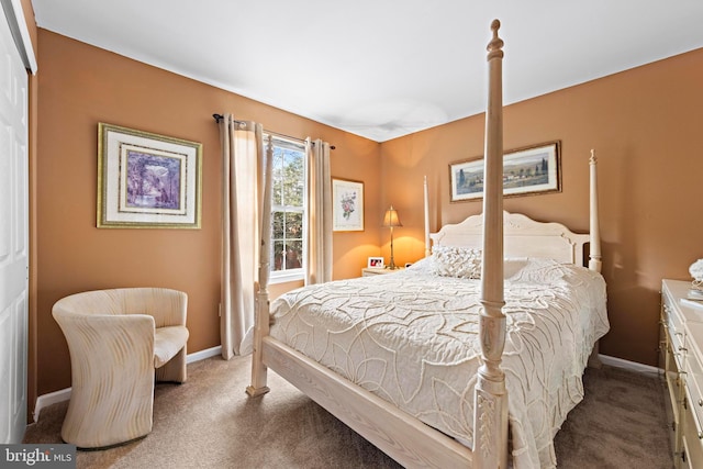 carpeted bedroom featuring baseboards