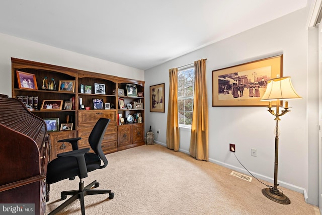 office area featuring carpet, visible vents, and baseboards