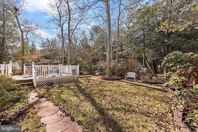 view of yard with a deck