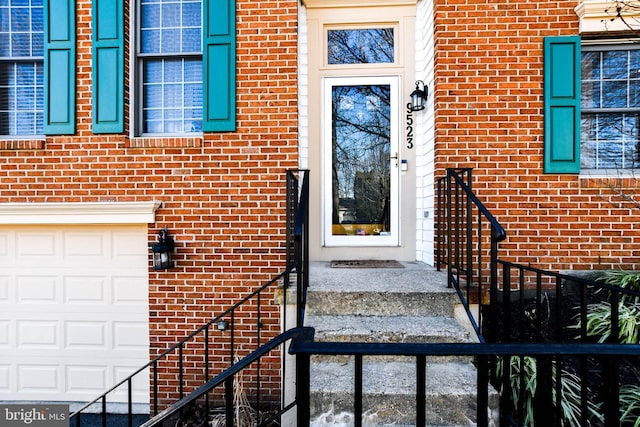 entrance to property featuring a garage