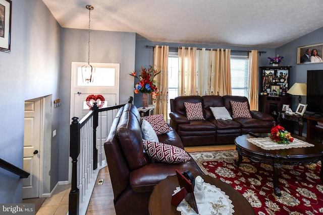 living area featuring lofted ceiling