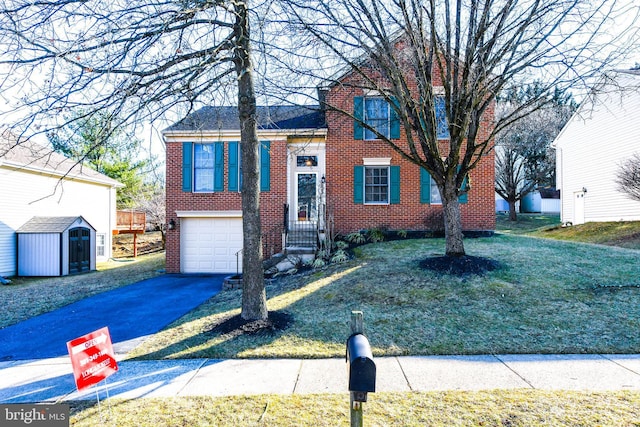 view of front of property featuring brick siding, an outbuilding, aphalt driveway, and a garage