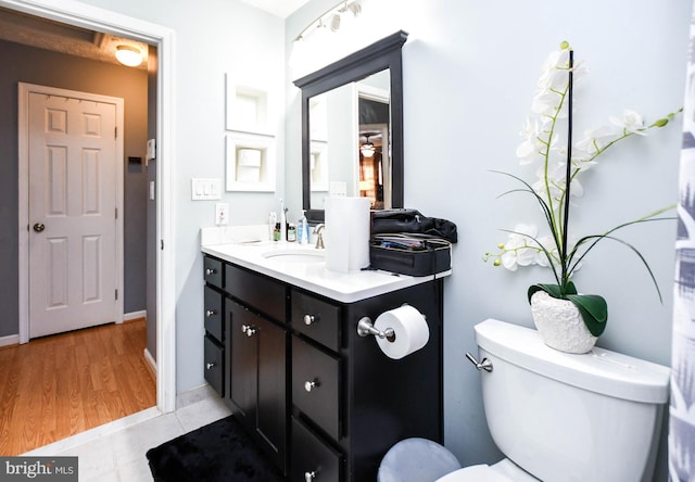 bathroom with vanity, tile patterned floors, and toilet